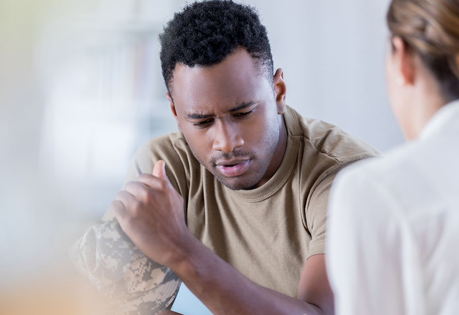 service member speaking with employee