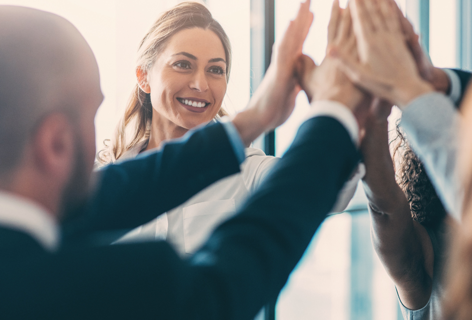 team of employees high fiving