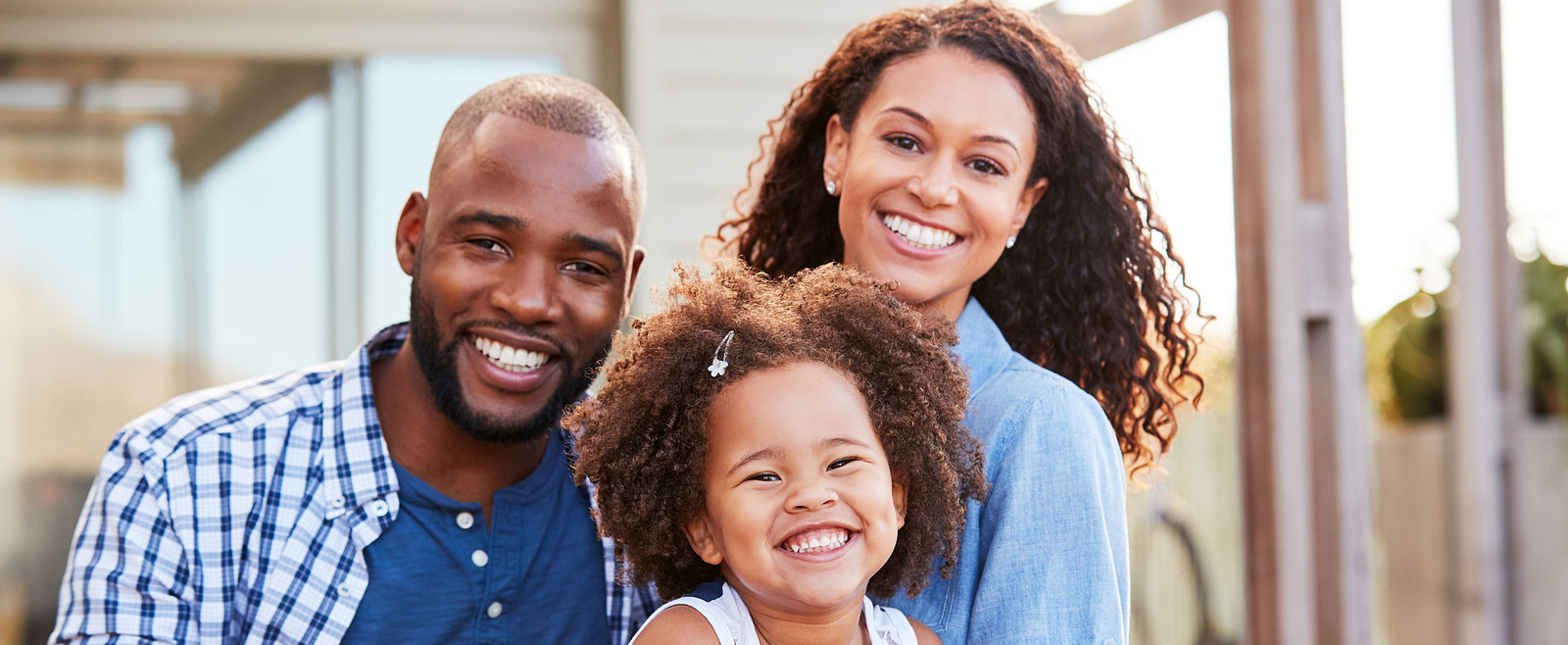 Family smiling while sitting together