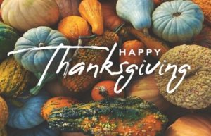 Gourds and small pumpkins; “Happy Thanksgiving.”