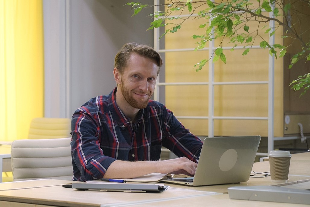 Man working on paperwork at desk